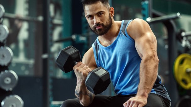 handsome-bodybuilder-picking-up-dumbbells-at-gym-3JAMLMS-1.jpg